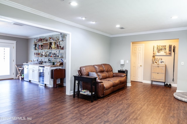 living room with bar area, crown molding, and dark hardwood / wood-style floors