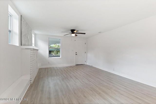 spare room with ceiling fan and light hardwood / wood-style floors