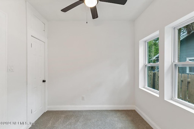 unfurnished room featuring carpet and ceiling fan