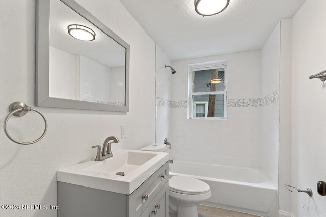 full bathroom with tiled shower / bath combo, vanity, and toilet