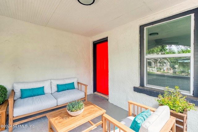 view of patio / terrace featuring ceiling fan and an outdoor living space