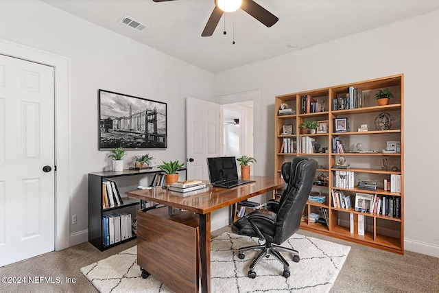 home office featuring carpet floors and ceiling fan