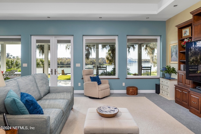 carpeted living room with french doors