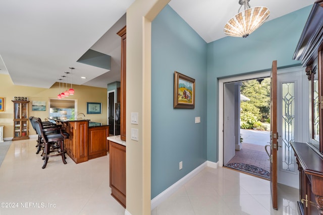 entrance foyer featuring light tile patterned flooring