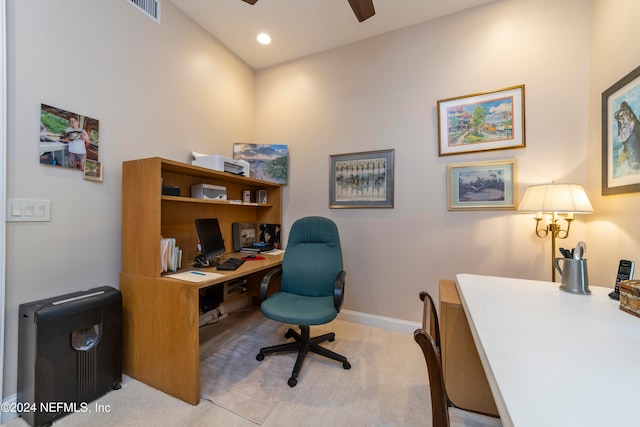 carpeted office featuring ceiling fan