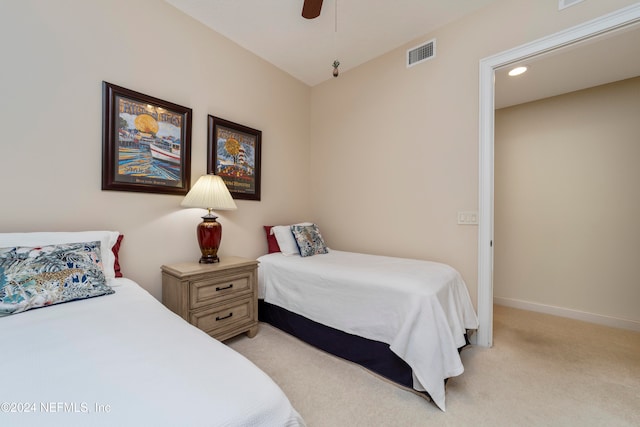 bedroom with ceiling fan and light colored carpet