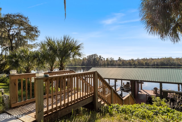 dock area featuring a deck with water view