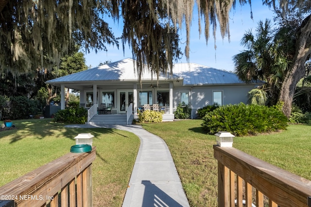 view of front facade with a porch and a front lawn