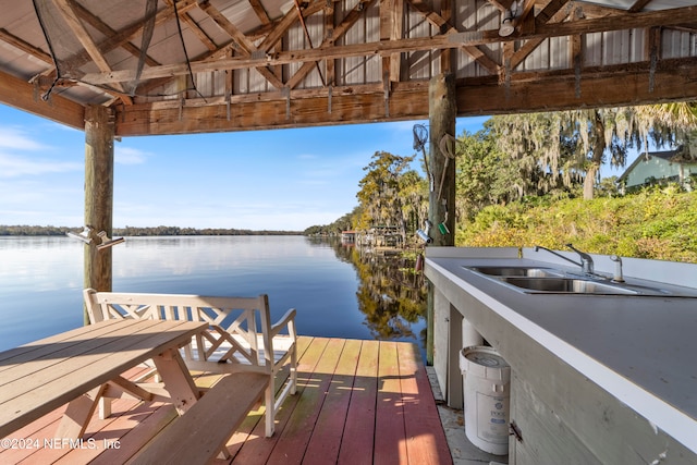 dock area with sink and a water view