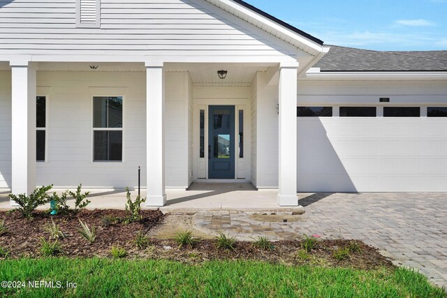 property entrance with a garage