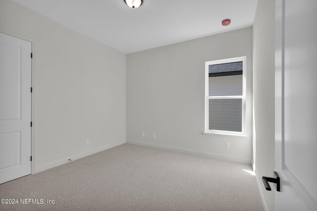 empty room with carpet flooring