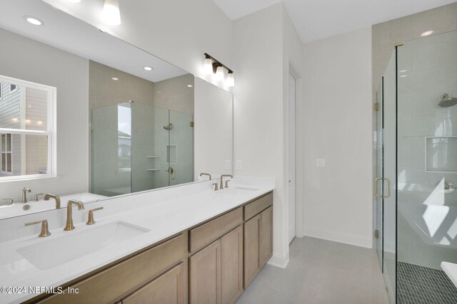 bathroom with vanity and an enclosed shower