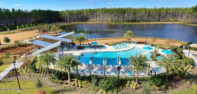 view of pool featuring a water view