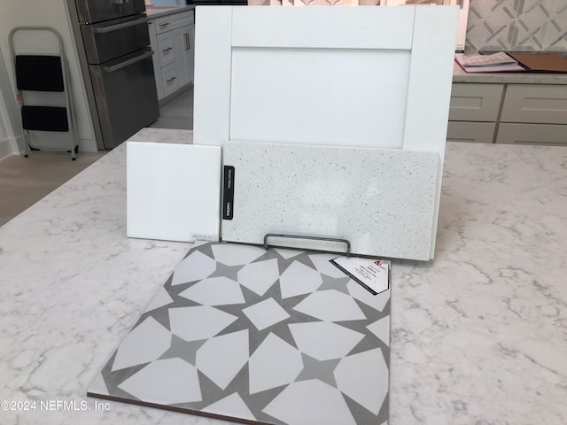 interior details with gray cabinets and fridge