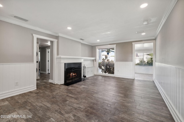 unfurnished living room with crown molding and dark wood-type flooring