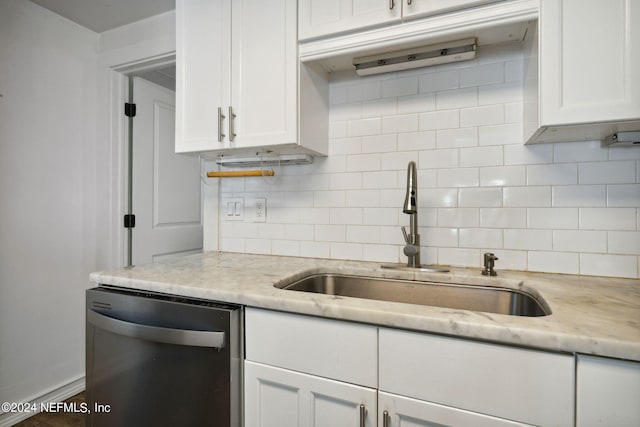 kitchen featuring sink, white cabinetry, tasteful backsplash, dishwasher, and light stone countertops