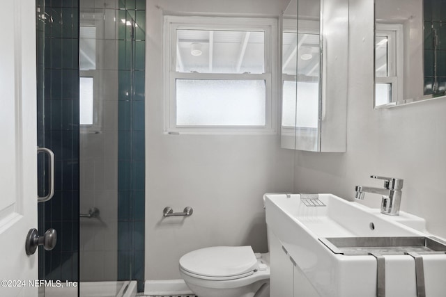 bathroom featuring vanity, toilet, and an enclosed shower