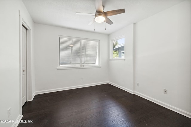 unfurnished bedroom with dark hardwood / wood-style floors, ceiling fan, and a closet