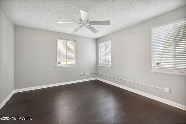 unfurnished room with dark wood-type flooring, a textured ceiling, and ceiling fan