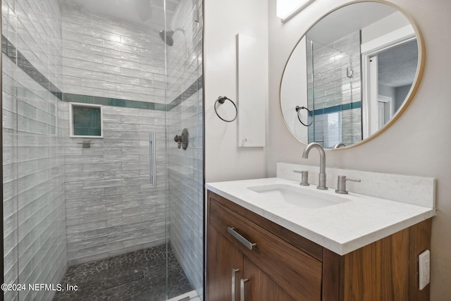 bathroom featuring vanity and walk in shower