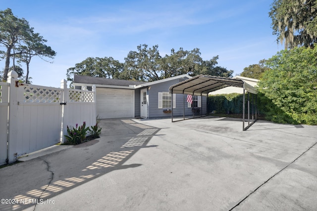 exterior space featuring a garage and a carport