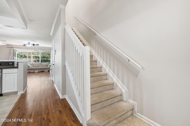 stairway featuring wood-type flooring