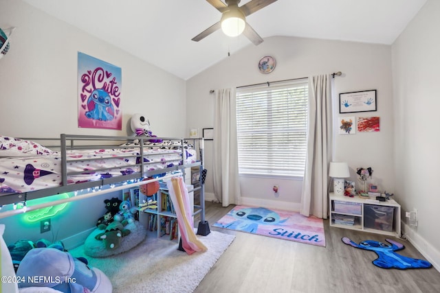 bedroom featuring wood-type flooring, vaulted ceiling, and ceiling fan