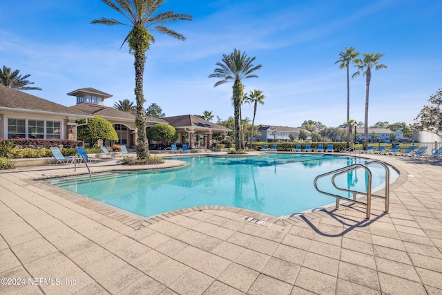 view of swimming pool featuring a patio