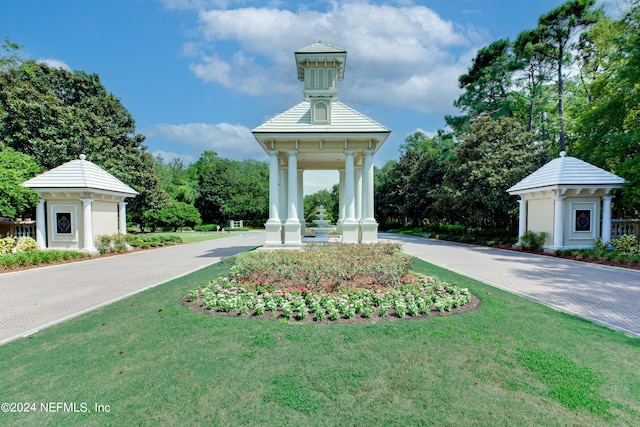 view of property's community with a yard