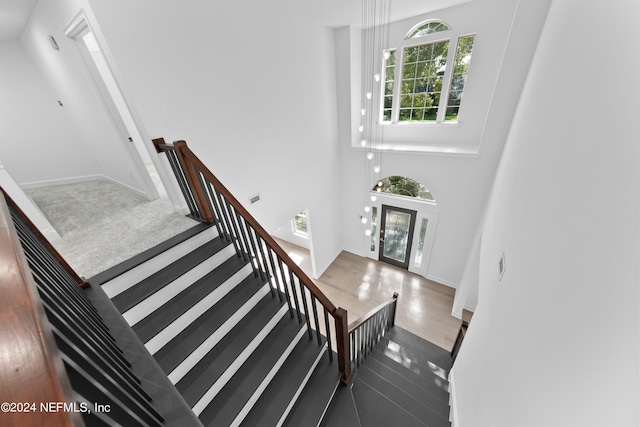 stairway featuring french doors and hardwood / wood-style flooring