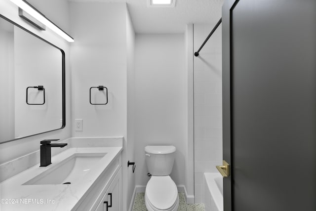 full bathroom with tile patterned floors, toilet, shower / bath combination, vanity, and a textured ceiling