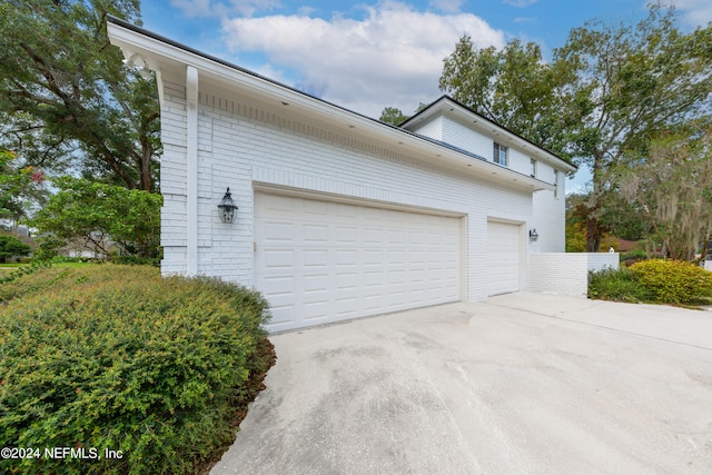 view of side of home with a garage