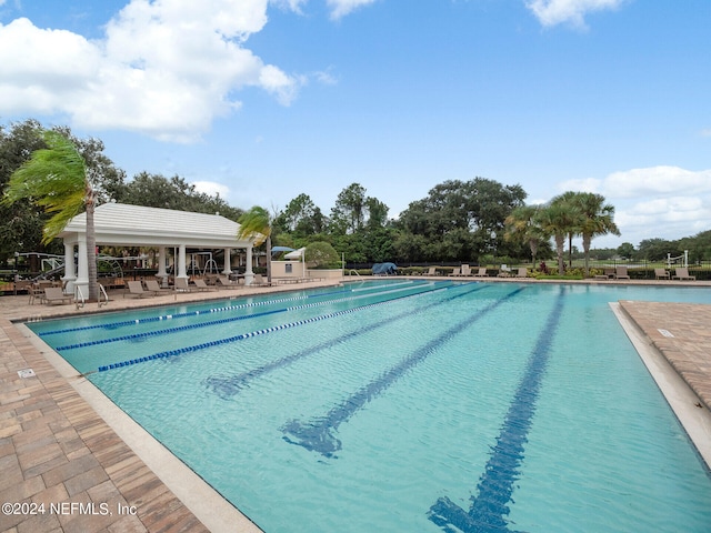 view of pool featuring a patio area