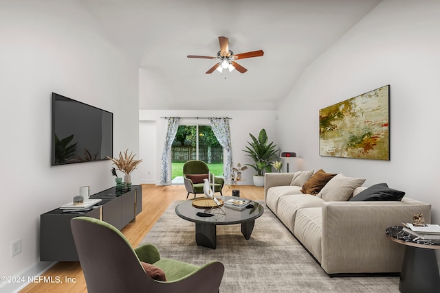 living room with lofted ceiling, light hardwood / wood-style floors, and ceiling fan