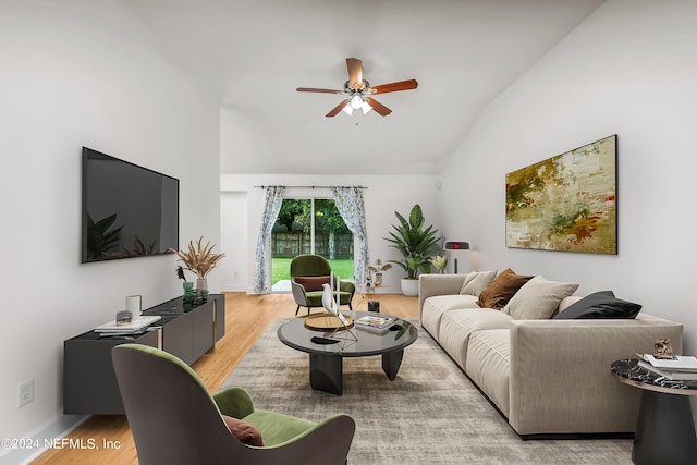 living room with light wood-type flooring, ceiling fan, and vaulted ceiling
