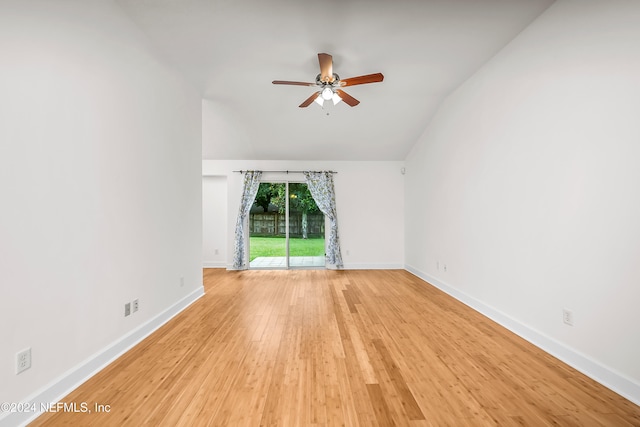 unfurnished room featuring light hardwood / wood-style flooring, vaulted ceiling, and ceiling fan