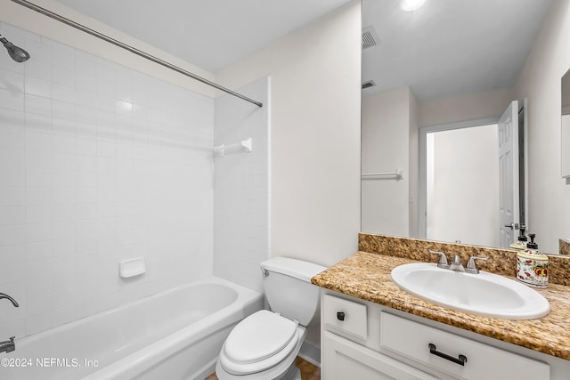 bathroom with toilet, vanity, visible vents, and shower / bathtub combination