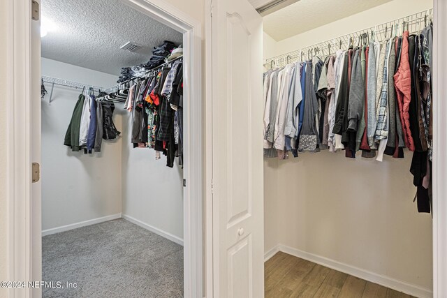 spacious closet featuring light wood-type flooring