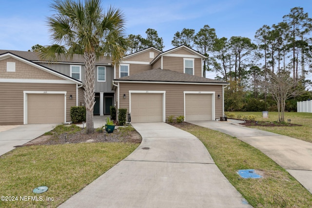 view of front facade featuring a garage and a front yard