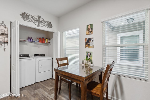 dining room with wood-type flooring and washing machine and dryer