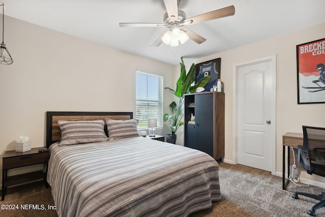 bedroom with ceiling fan and carpet floors