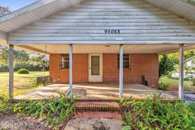 exterior space with a carport