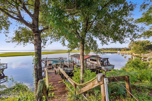 dock area featuring a water view