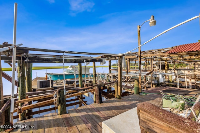 dock area featuring a water view