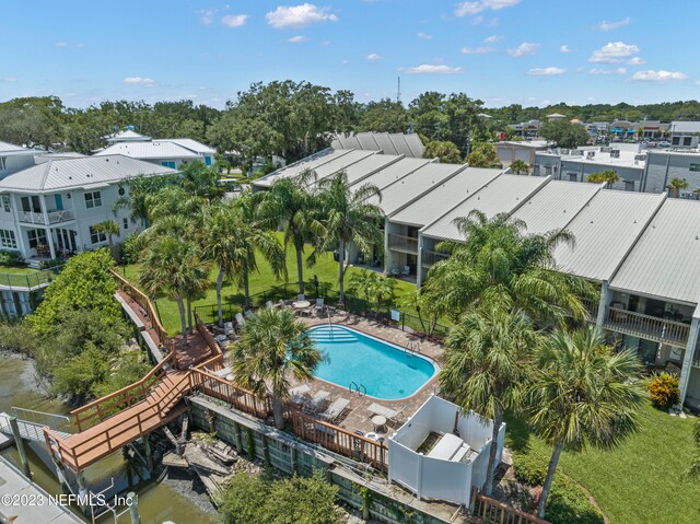 exterior space with a patio and a water view