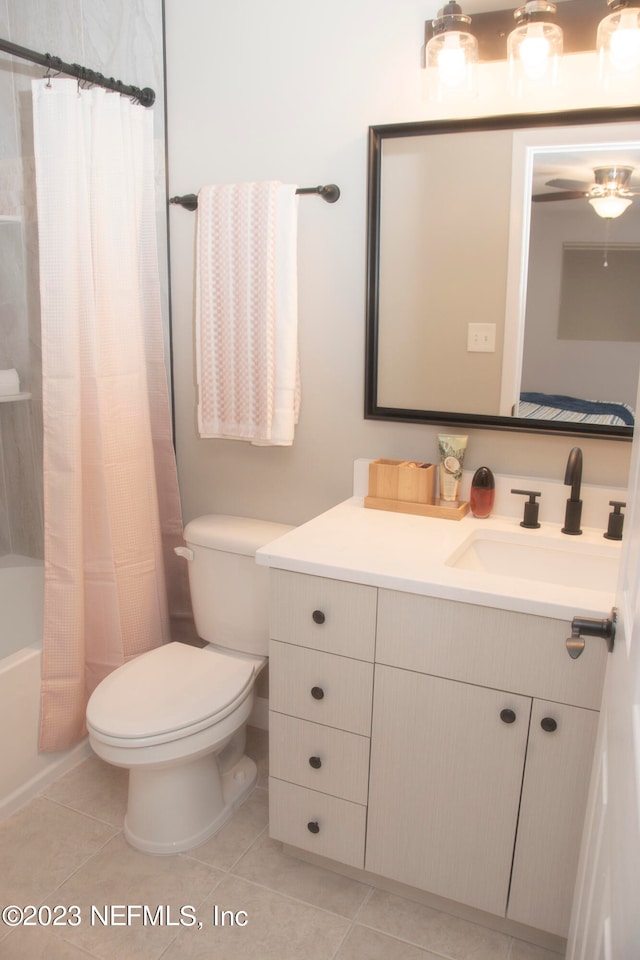 full bathroom with tile patterned flooring, vanity, toilet, and shower / bath combo