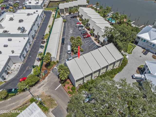 birds eye view of property with a water view