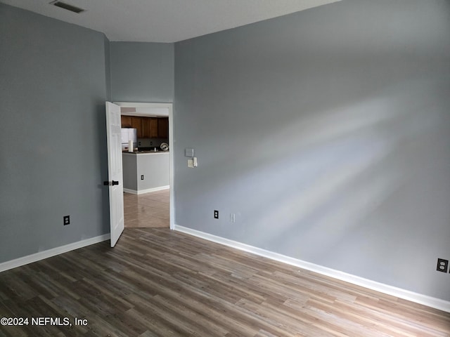 empty room featuring hardwood / wood-style floors