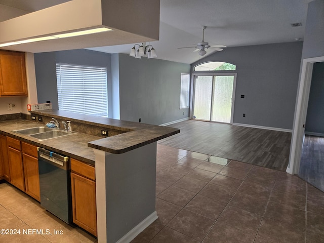 kitchen with black dishwasher, kitchen peninsula, wood-type flooring, ceiling fan, and sink