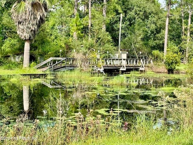 surrounding community featuring a water view